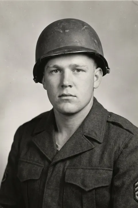 Identification photograph of a broad-faced sergeant in a steel helmet, expression neutral.